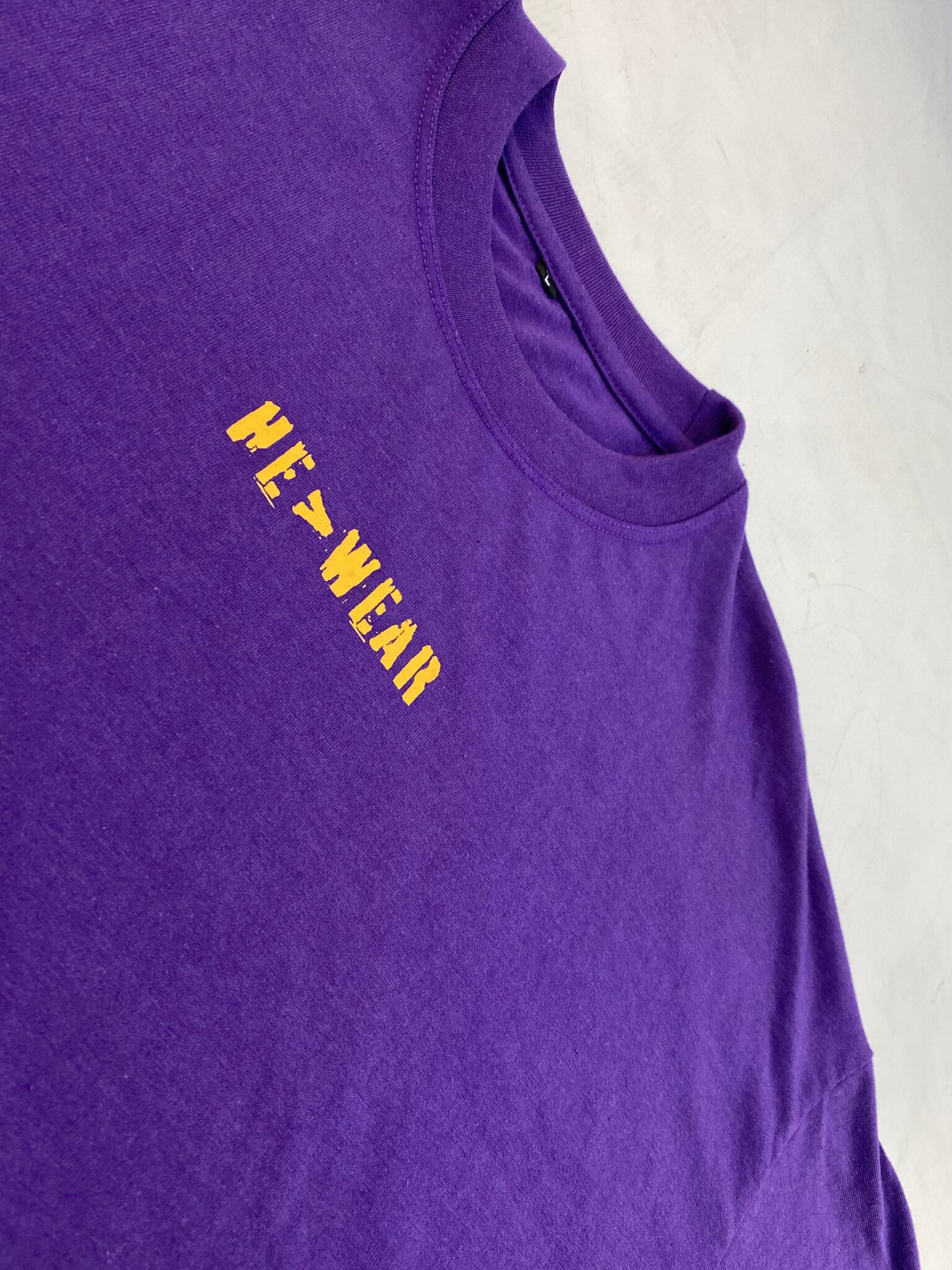 Closeup of front screen printed design on t-shirt with smooth print finish