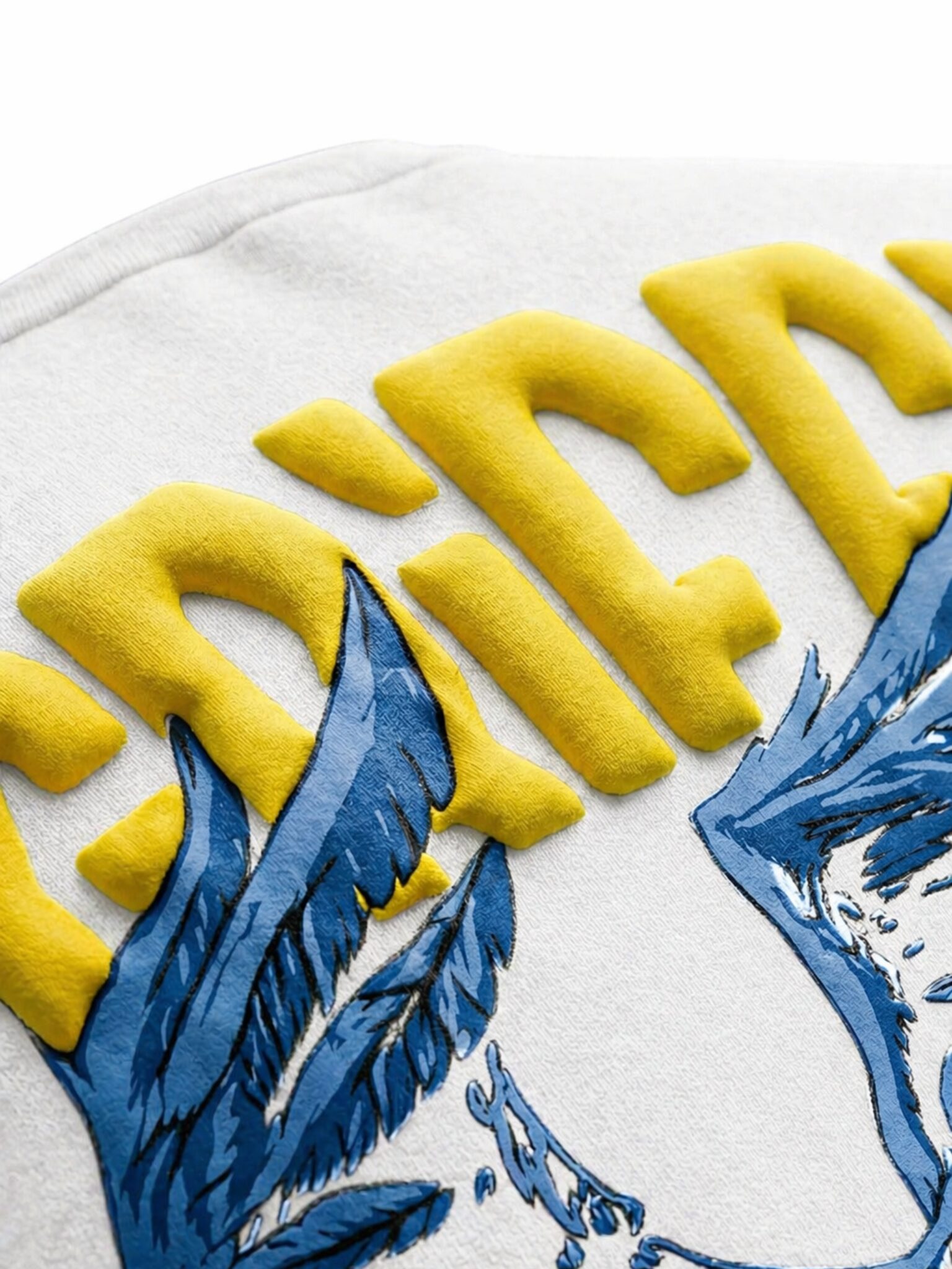 Closeup of puff print on t-shirt showing raised texture and 3D effect