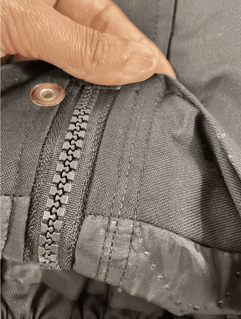 Close-up of heavy-duty zipper on industrial workwear