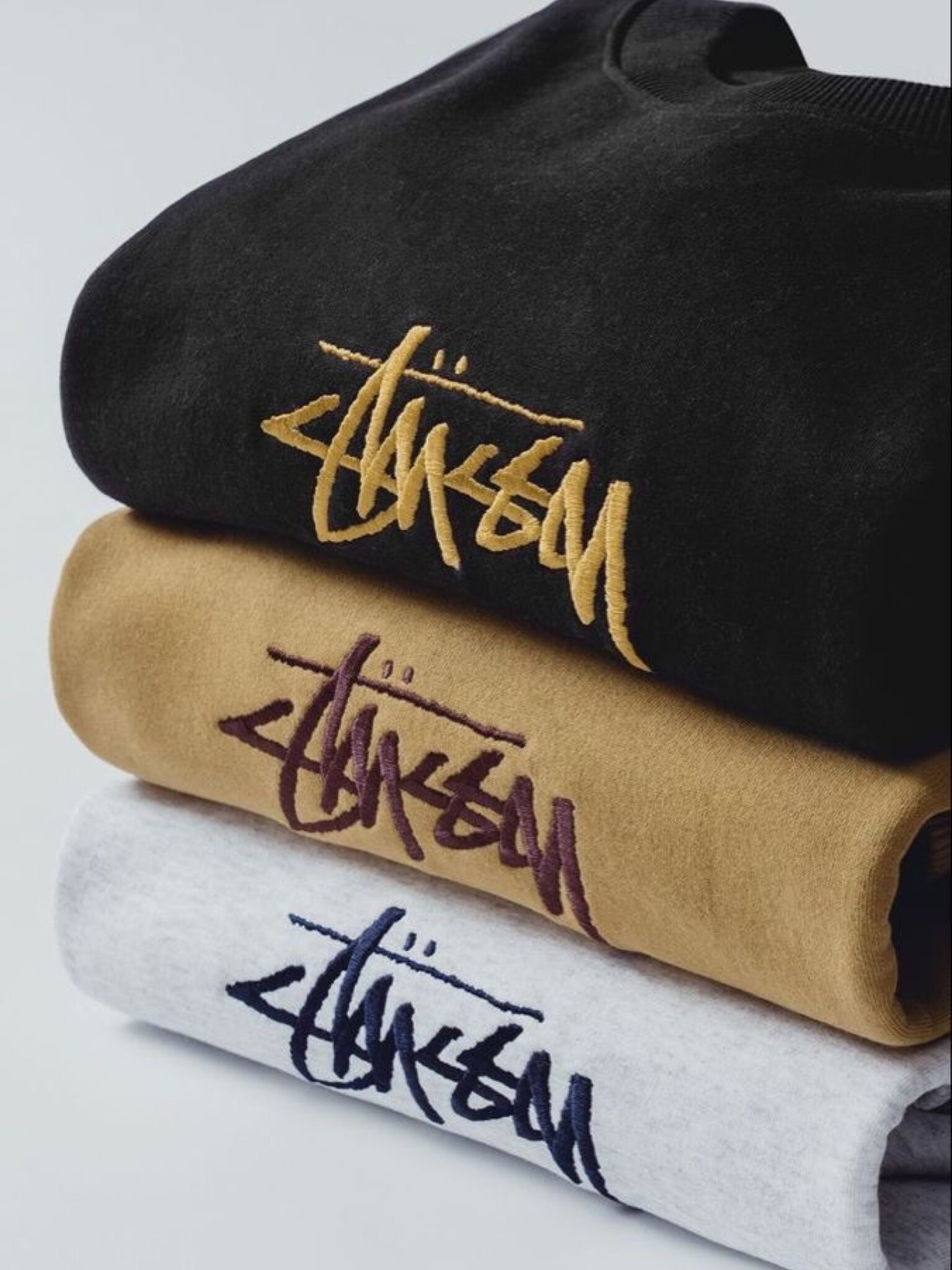 Closeup of embroidered logo on t-shirt showing thread detail and precision